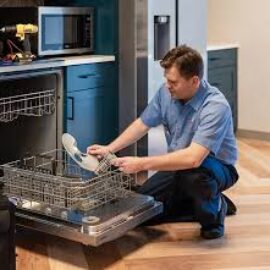 Our technician is repairing the dishwasher.
